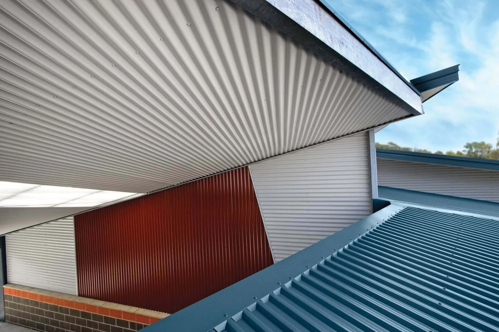Profiled roof and wall cladding